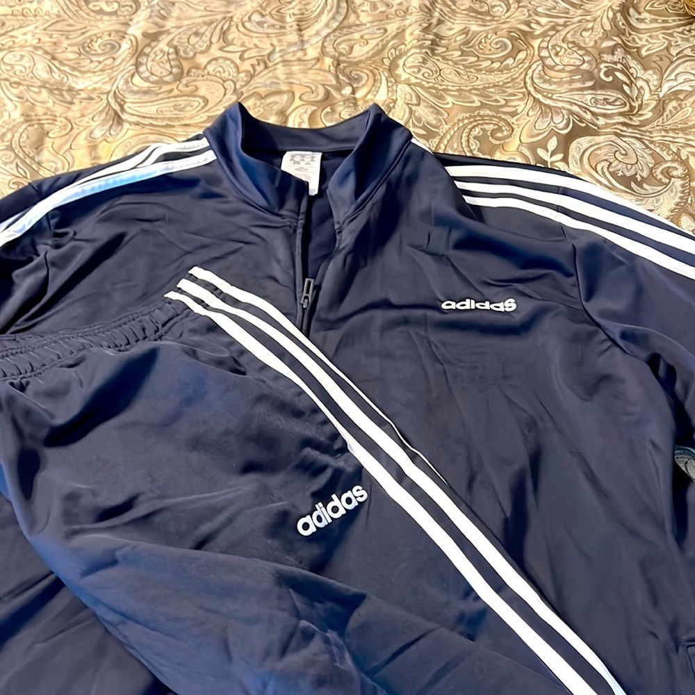 Adidas jogging suit.